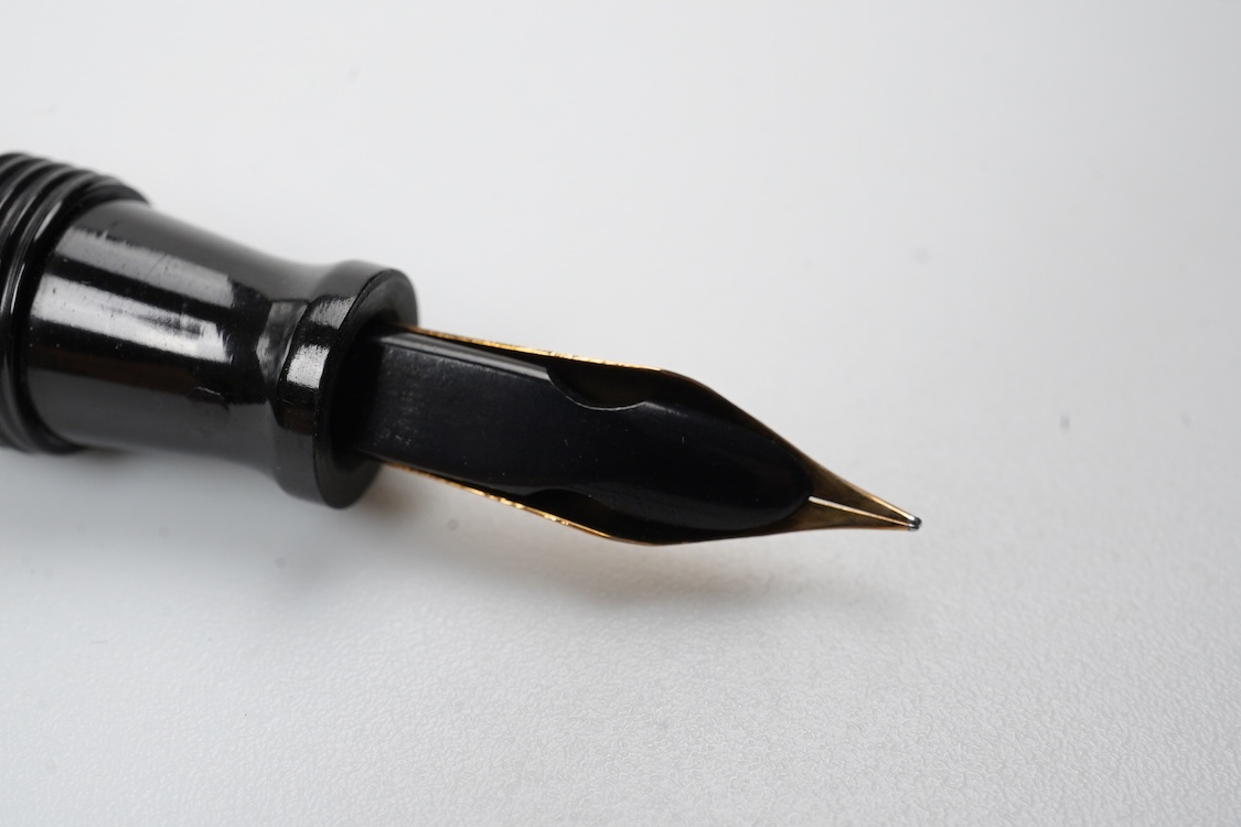 A Conklin ring top hand engraved crescent filler fountain pen with 14ct. gold Conklin flexible nib